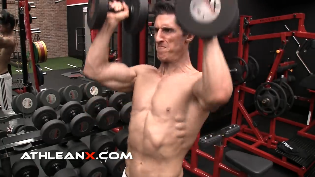 dumbbell standing overhead press for shoulder strength